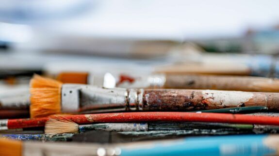 Paint brushes on table